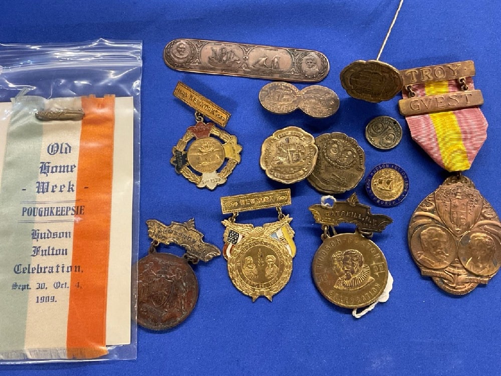 Fourteen (14) Hudson Fulton Celebration Medals and Souvenirs: Fourteen (14) Hudson Fulton Celebration Medals and Souvenirs. Hat pin, bronze book mark, medals, Old Home Week Poughkeepsie NY Ribbon, Two (2) Newburgh, NY Medals, Troy NY Guest Medal by Whitehead Hoa