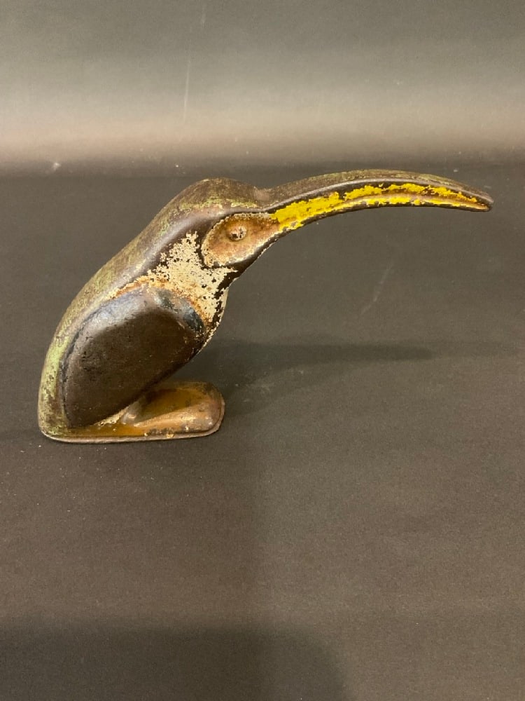 Cast Iron Hummingbird Doorstop: Cast Iron Hummingbird Doorstop. Original paint present. Dimensions: 4” x 8”
