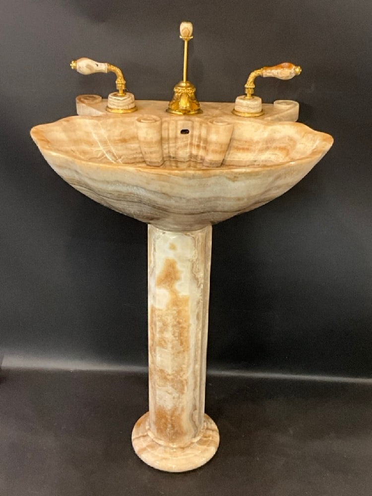 Outstanding Carved Onyx Shell Form Sink by Sherle - Wagner: Outstanding Sherle and Wagner carved onyx shell form sink with matching gold plated and onyx hardware. Dimensions: 39" h X 25 1/2"w X 21"d. Note: One edge chip noted to sink basin along edge. Please s