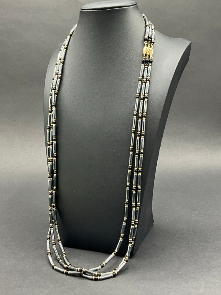 14K Gold Onyx and Hematite Three Strand Necklace: 14K Gold Onyx and Hematite Three Strand Necklace. Dimensions: 30” length.Total weight: 81.5 grams