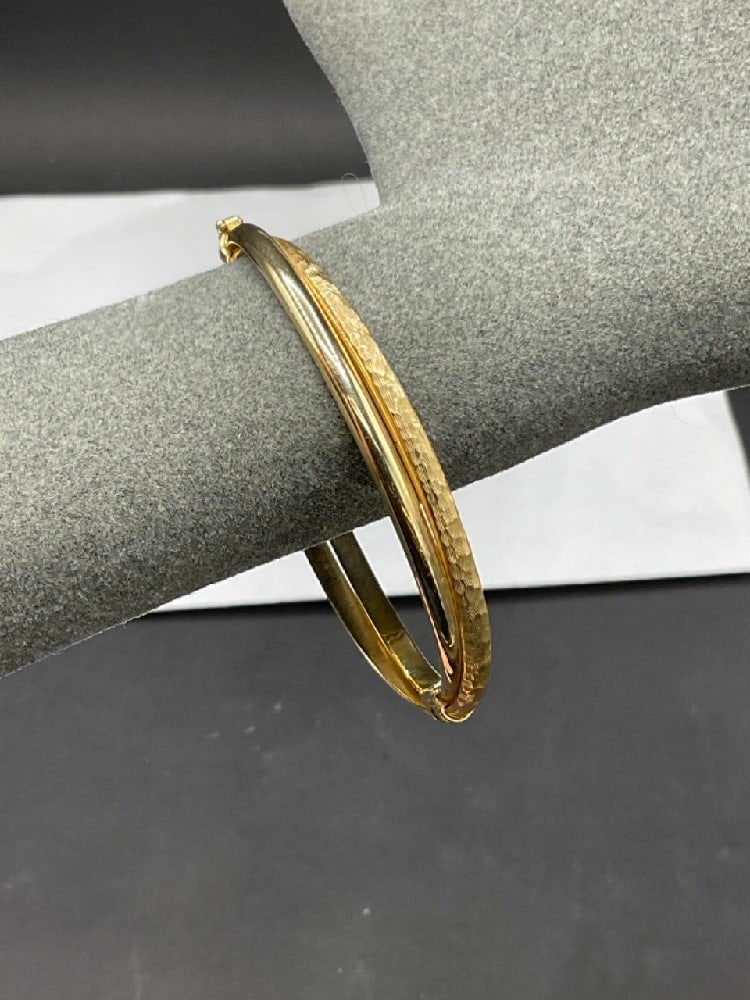 14K Hinged Yellow Gold Double Bangle Bracelet: 14K Hinged Yellow Gold Double Bangle Bracelet. Dimensions: 3" length. Total weight: 8.7 grams.