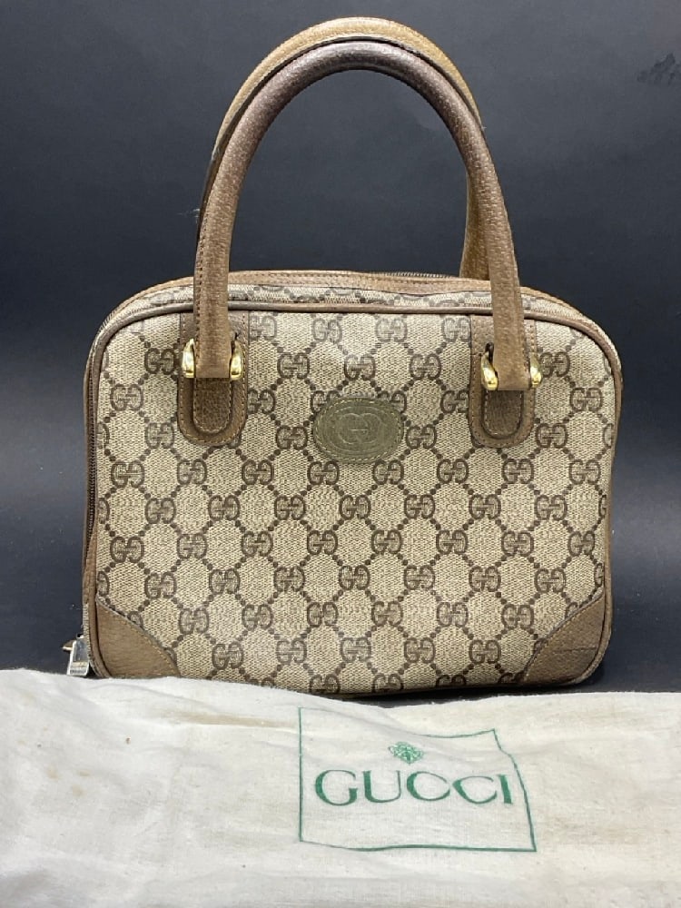 Vintage Gucci Handbag: Vintage Gucci Handbag. Clean and in good condition. Some soiling interior and straps have wear.Dust bag is soiled. PLease see photograph preview. Dimensions: 8” x 9 1/2” 6” strap dro