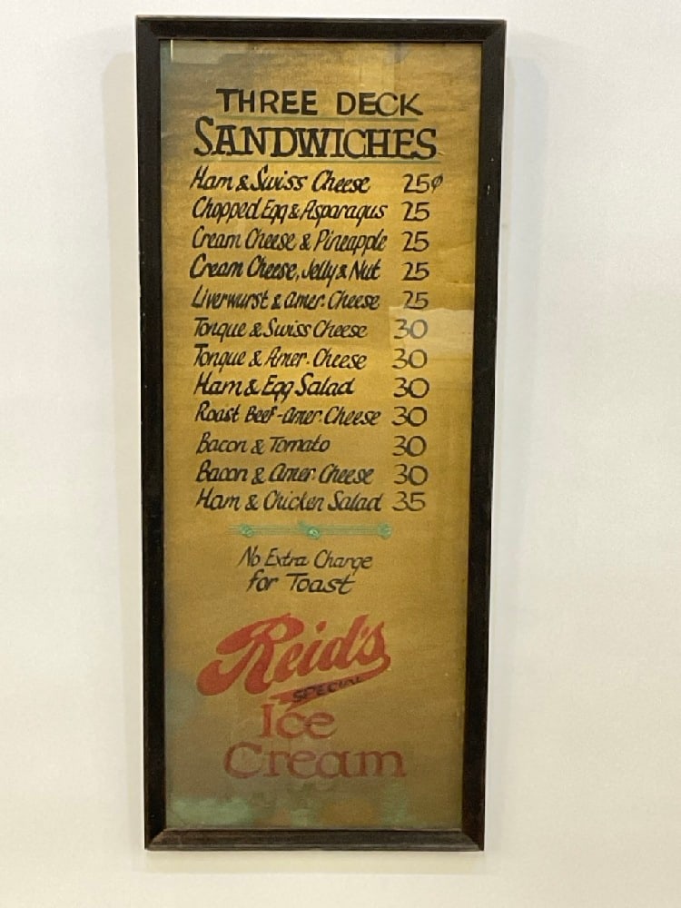 Foiled Luncheonette Menu "Reid's Special Ice Cream": Foiled Luncheonette Menu advertising Reid's Special Ice Cream.Dimensions: 29” x 12” Reid’s Special Ice cream.