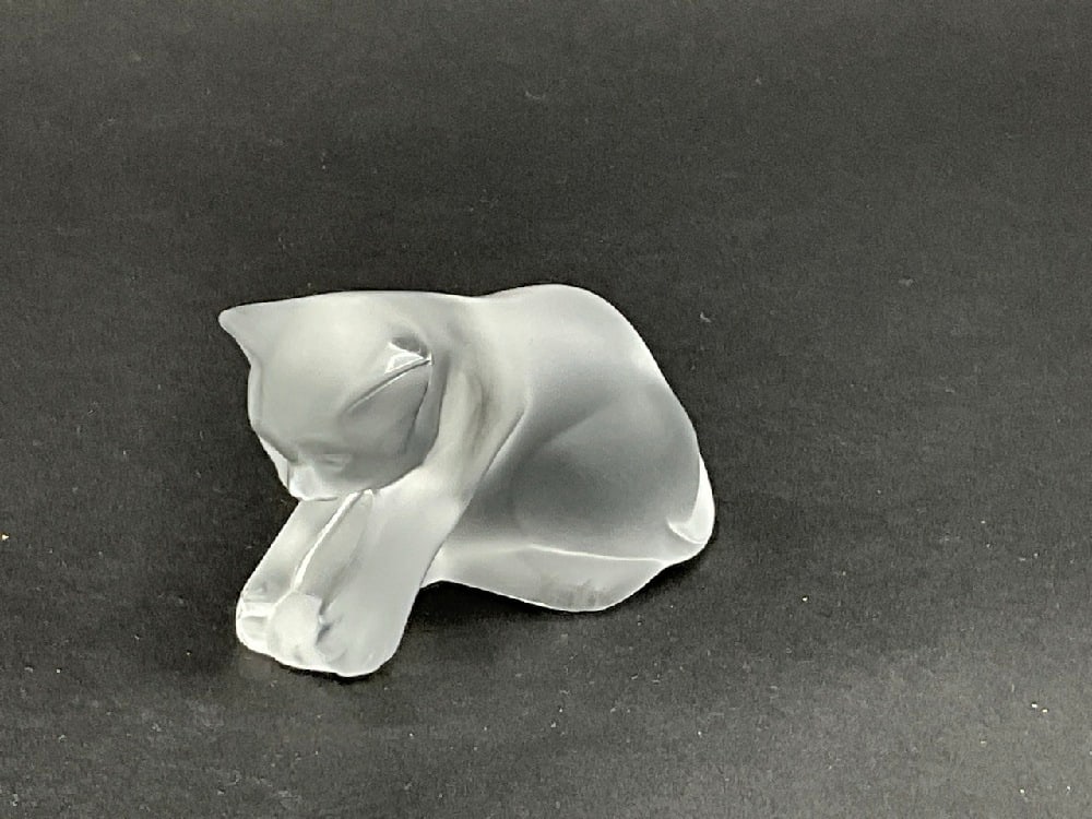 Playful Lalique Crystal Cat Figurine: Lalique crystal cat playing with ball. Dimensions: 2" X 3"