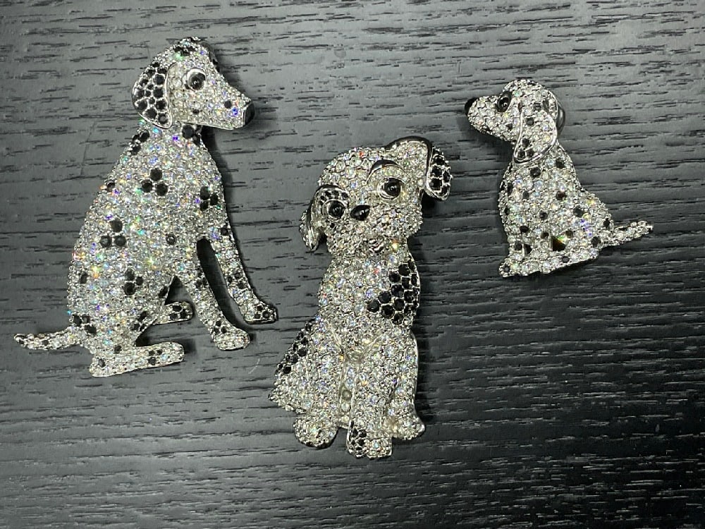 Three (3) Swarovski Dalmatian Dog Pins: Three (3) Swarovski Crystal Dalmation Pins. Quality Costume Jewelry Group. Dimensions: 2 7/8” x 1 1/2” , 2 1/2” x 1 1/4” and 1 3/8” x. 1 1/4”