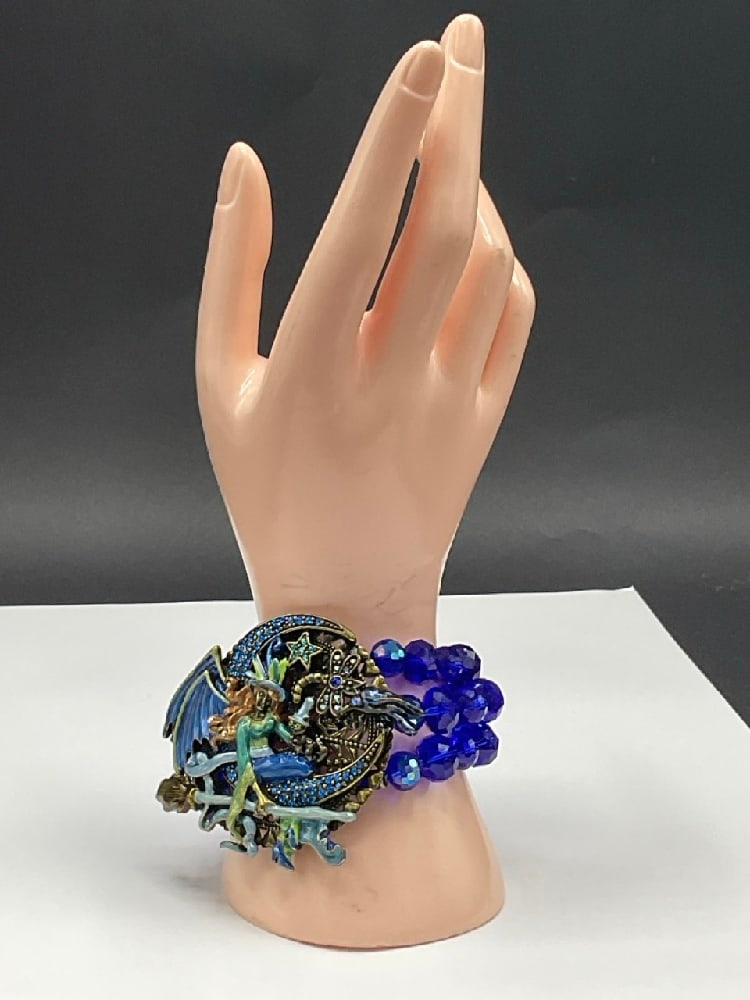 Kirk’s Folly Witch Bracelet: Kirk's Folly Witch Bracelet. Dimensions: 2 3/4” x 3” and 4” span.