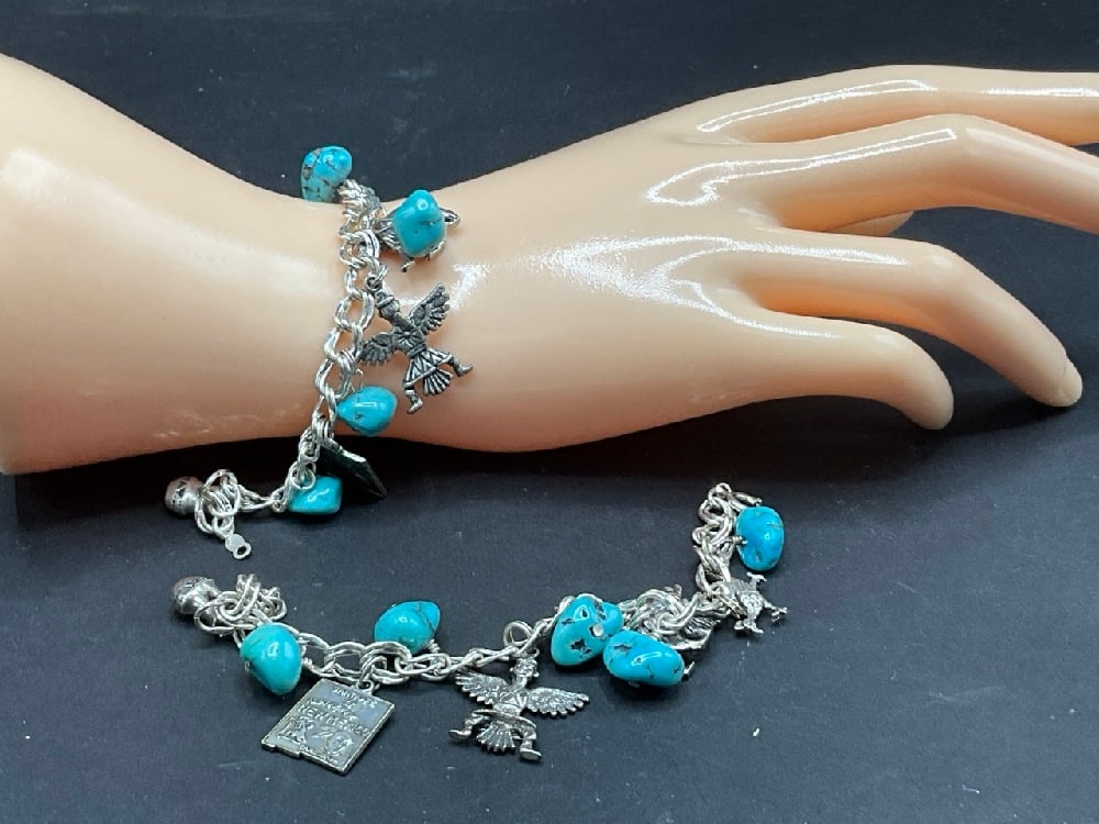 Two (2) Sterling Silver Turquoise Indian New Mexico Charm Bracelets: Two (2) Sterling Silver Turquoise Indian New Mexico Charm Bracelets.Dimensions: 6 3/4” .Total weight: 60.5 grams