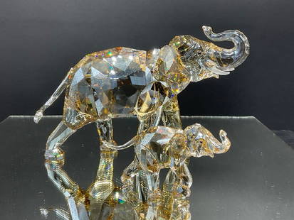 Swarovski Crystal Mother and Baby Elephant: Swarovski Crystal Mother and Baby Elephant.Dimensions: 4 1/2” x 7” x 2” largest