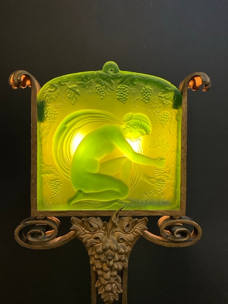 1920's Steuben Glass Art Deco Floor Lamp: A fine 1920's period Art Deco wrought iron floor lamp attributed to Oscar Bach with Steuben green glass shade panel with a nude maiden harvesting grapes with an all over grape-on-vine motif with metal