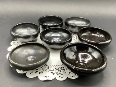 Seven (7) Black Pottery Bowls