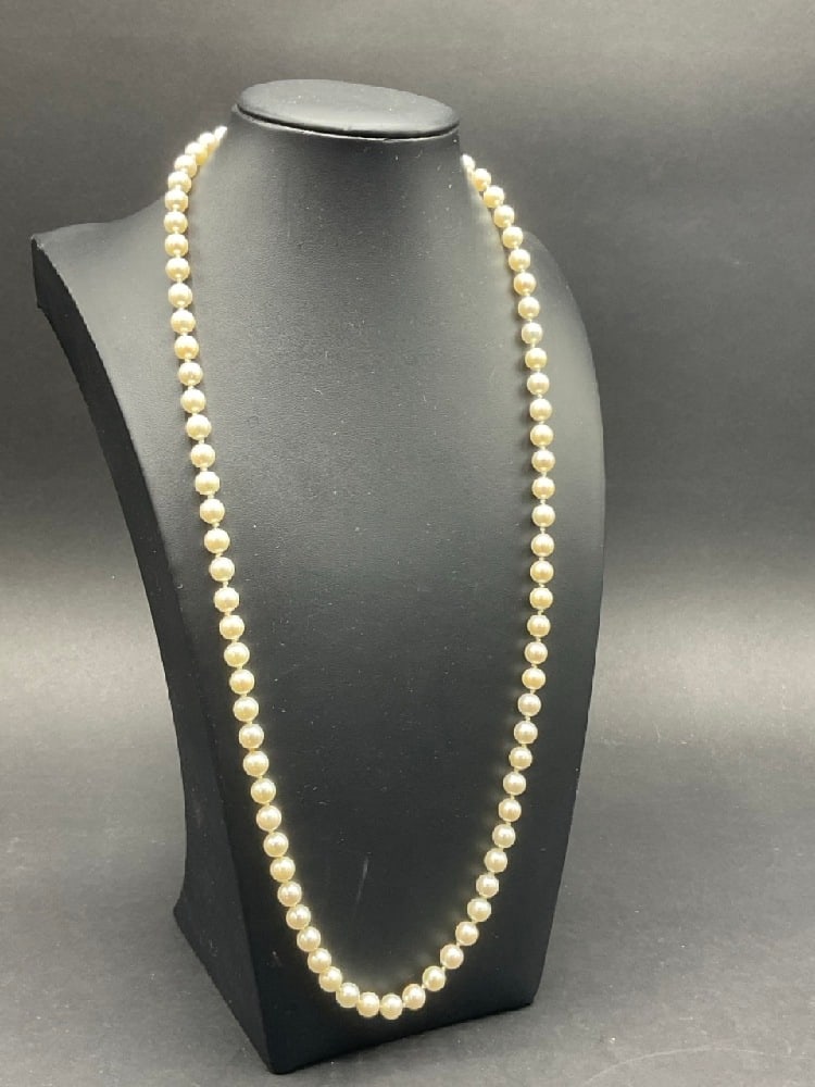 25" 14K Gold Freshwater Pearl Necklace: 25" Freshwater Pearl Necklace with 14K Yellow Gold Clasp. Total weight: 34.25 grams. 1/4" diameter.