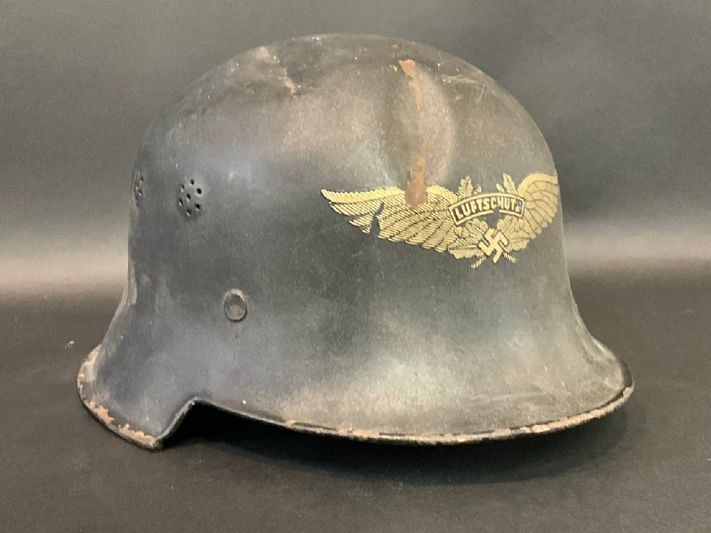 German WWII Lutfwaffe Police Helmet: German WWII Lutfwaffe Police Helmet with liner. Dimensions: 7” x 11 1/2” x 1/2”