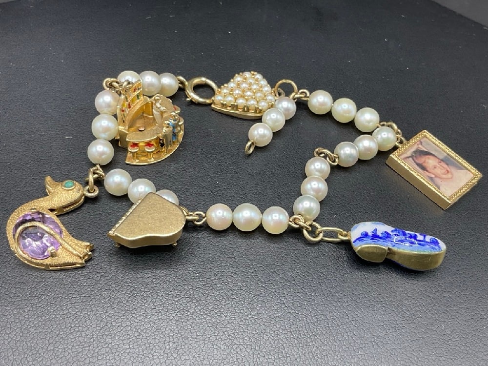 14K Yellow Gold Pearl Charm Bracelet: 14K Yellow Gold Pearl Charm Bracelet. Dimensions: 7 1/4” LTotal weight: 22.6 grams.