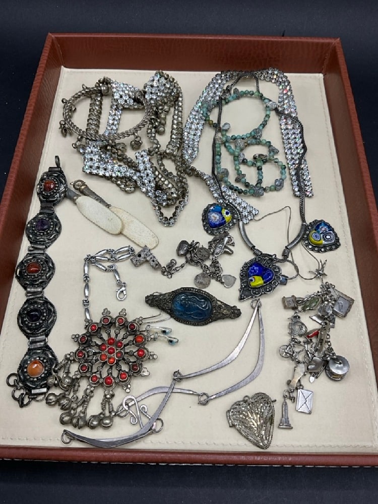 Estate Compiled Costume and Sterling Silver Jewelry Group: Estate Compiled Costume and Sterling Silver Jewelry Group.Two sterling silver vintage charm bracelets, rhinestones, Chinese glass fish and silver pin, Modernist sterling necklace in style of Calder (o