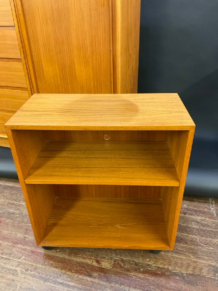 Danish Modern Teakwood Rolling Bookcase: Danish Modern Teakwood Rolling Bookcase. Doily Stain noted. Please see photograph preview. Dimensions: 26 1/2” x 24” x 12”