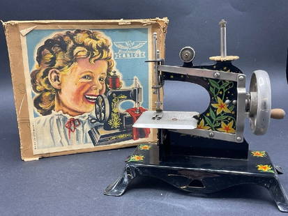 Casige Child’s Sewing Machine with Original Box: Casige Child’s Sewing Machine with Original Box. Made in Germany. Box is in poor condition.Dimensions: 7 1/2&rdquo; x 7 1/2&rdquo; x 4&rdquo;