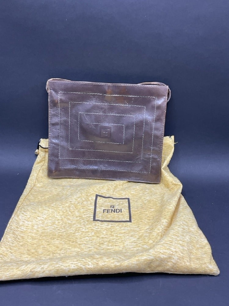 Vintage Fendi Brown Leather Envelope Bag: Vintage Fendi Brown Leather Envelope Bag. Includes dustbag.Dimensions: 8” x 9 1/4” x 1” closed 18” strap drop