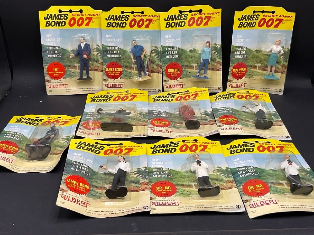 Eleven (11) Gilbert 1960’s James Bond 007 Action Figures: Eleven (11) Gilbert 1960’s James Bond 007 Action Figures.Some surface residue seen on a couple figures. Packaging has wear. Please see photograph preview.