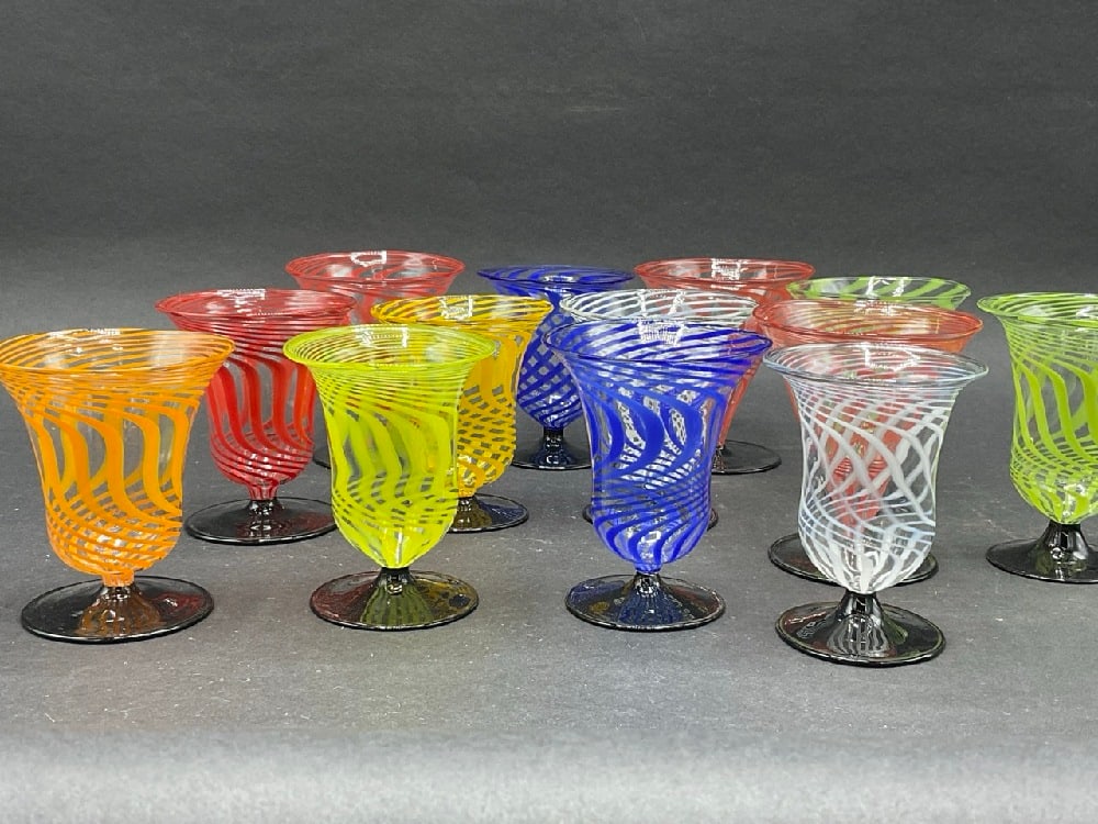 Thirteen (13) Bimini Werkstatte Vintage Swirl Glasses: Thirteen (13) Bimini Werkstatte Vintage Swirl Glasses. Two having different bases from rest. Dimensions: 3 1/4” x 3”