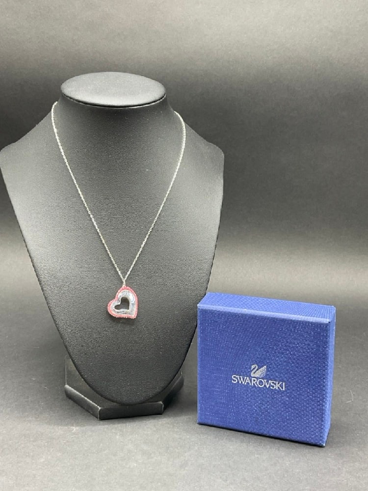 Swarovski Crystal Heart Necklace: Swarovski Crystal Heart Necklace. Includes original box. Dimensions: 1/2” pendant and 17” chain.