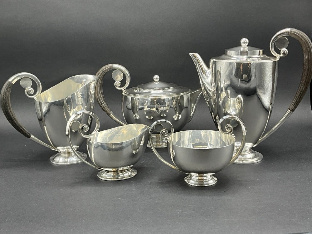 Five (5) Piece Georg Jensen Wendel AS Sterling Silver Tea Set: Five (5) Piece Georg Jensen Wendel A/S Sterling Silver Tea Set. Tea pot, coffee pot, pitcher and sugar and creamer. Designed by Danish artist Johan Rohde (1856-1935) Total weight: 2,116 grams or 68.03