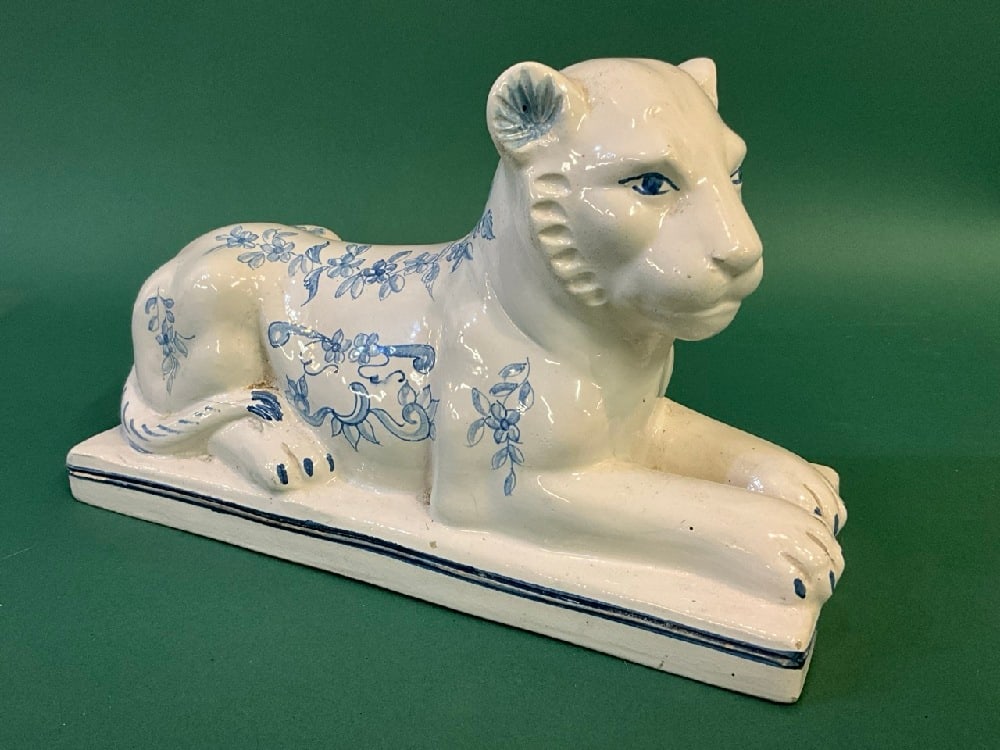 Tiffany & Co. Faience Style Ceramic Seated Lion Statue. 20th century, Made in Italy: Tiffany & Co. Faience Style Ceramic Seated Lion Statue. 20th Century, Made in Italy. Dimensions: 6 1??2" X 10” X 4.Dimensions: Several small chips on the base - see images.