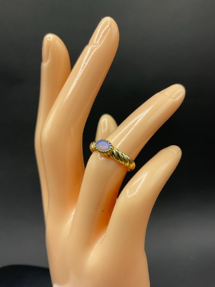 14K Gold Ring with Opal Gemstone: 14K Gold Ring with Opal Gemstone. Size 4. Signed “Isgal”. t.w: 3.50 grams.
