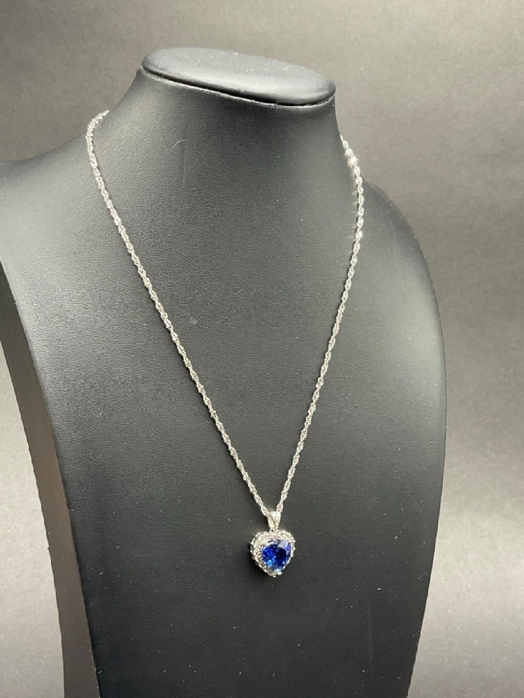 10K White Gold Blue Sapphire Heart Pendant Necklace: 10K Blue Sapphire Heart Pendant Necklace. t.w: 4.69 grams.Dimensions: 16” chain.