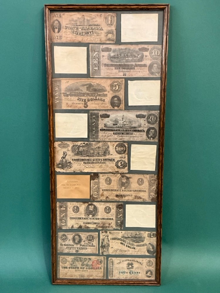 Compiled Collection of Confederate Money: Compiled Collection of Confederate Money. Mounted and displayed in frame. Dimensions: 29” x 12”