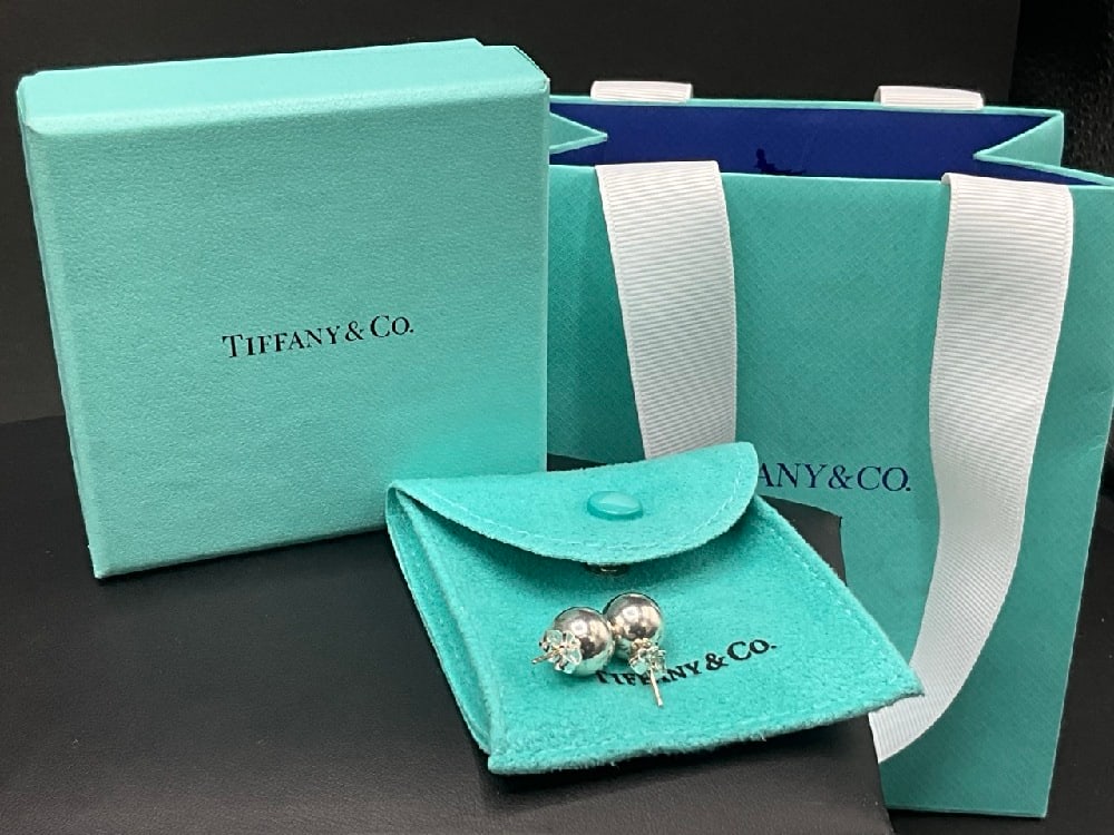 Tiffany and Company 1/4" Sterling Silver Pierced Ball Earrings: Tiffany and Company 1/4" Sterling Silver Pierced Ball Earrings. Includes pouch, box and bag.
