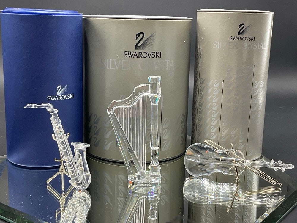 Swarovski Crystal Melodies Saxophone,Harp, Violin Figurines: Swarovski Crystal Melodies Saxophone 211728,Harp 169245, Violin 203056. Violin Designed by Gabriele Stamey, Harp is Signed, Saxophone Designed by Martin Zendron Good Condition, Please See Photographs