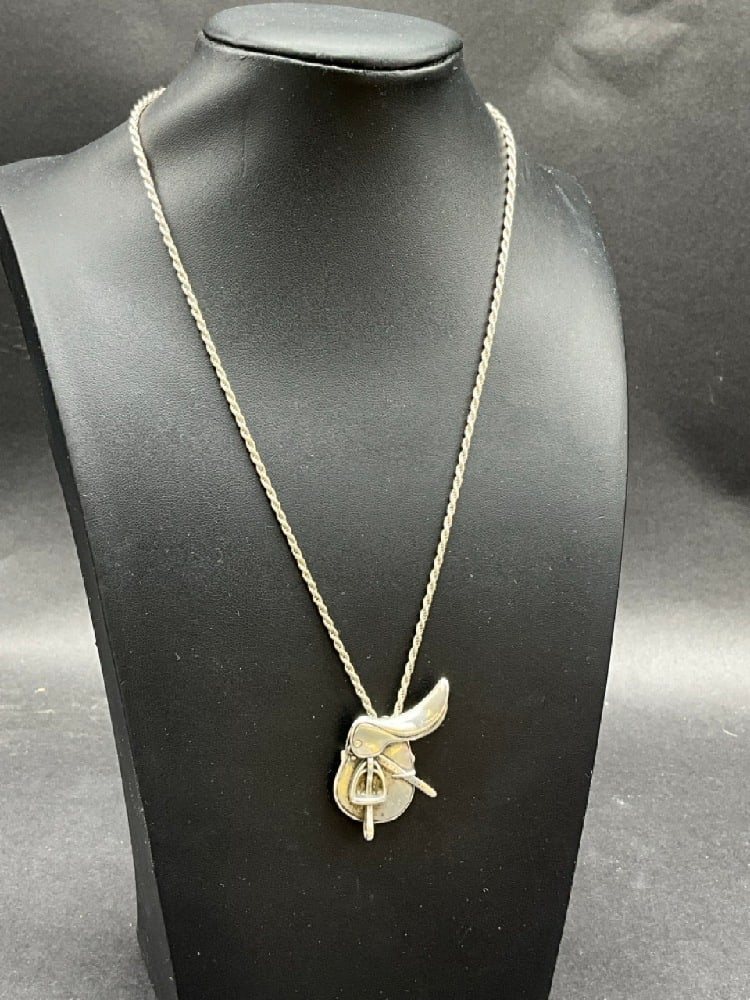 Equestrian Sterling Silver English Riding Saddle Pendant Necklace: Vintage H&H signed Sterling Silver Equestrian English Horse Riding Saddle Pendant NecklaceDimensions: 18” chain length and 2" pendantTotal weight: 15.3 grams. H&H Sterling 2”