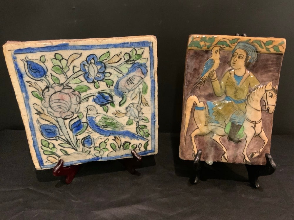 (2) Middle Eastern Qajar Dynasty Pottery Tiles: (2) Middle Eastern Qajar Dynasty Pottery Tiles.Condition: Crazing on both. Dimensions: Sm - 9 1/4” x 6 1/2” Lg - 9 1/2” x 9 1/2”