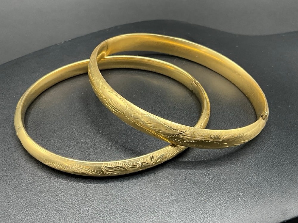 Two (2) Similar 14K Yellow Gold Engraved Bangle Bracelets: Two (2) Similar 14K Yellow Gold Engraved Bangle Bracelets.Total weight: 19.8 grams