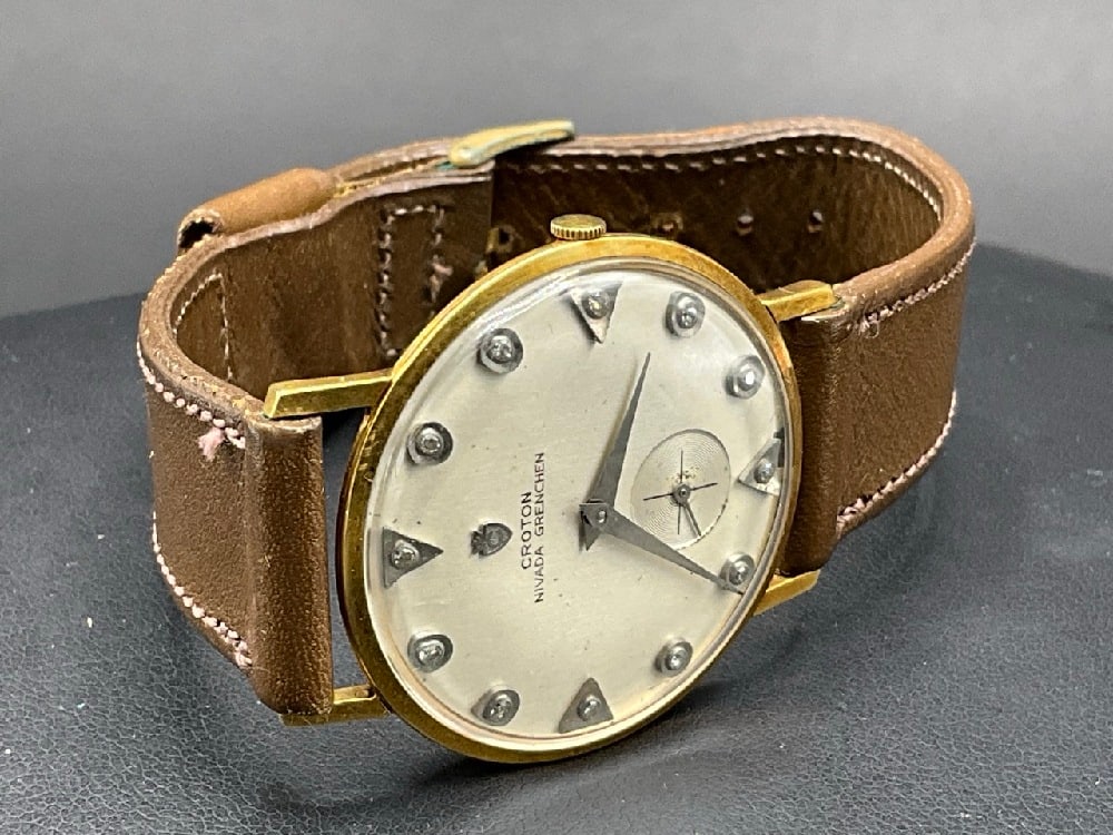 18K Yellow Gold Croton Nivada Grenchen Men’s Wristwatch: 18K Yellow Gold Croton Nivada Grenchen Men’s Wristwatch with Diamond Indices.Working Condition.Dimensions: 35mm FaceTotal weight: 25.4 grams