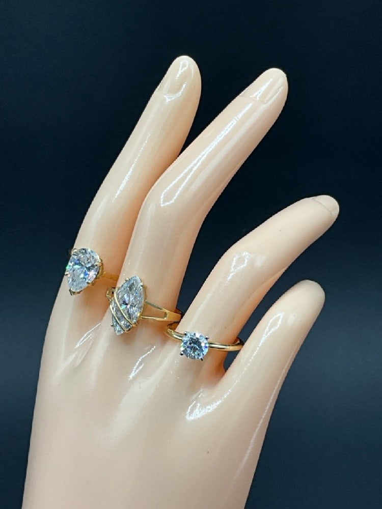 Three (3) 14K Yellow Gold CZ Rings: Three (3) 14K Yellow Gold CZ Stone Cocktail Rings. Total weight: 8.9 grams. Size 8 and 9.