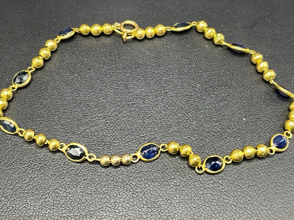 18K Yellow Gold Blue Sapphire Bracelet: 18K Yellow Gold Blue Sapphire Bracelet. Stamped 750. Dimensions: 7 1/4” LTotal weight: 2.8 grams.
