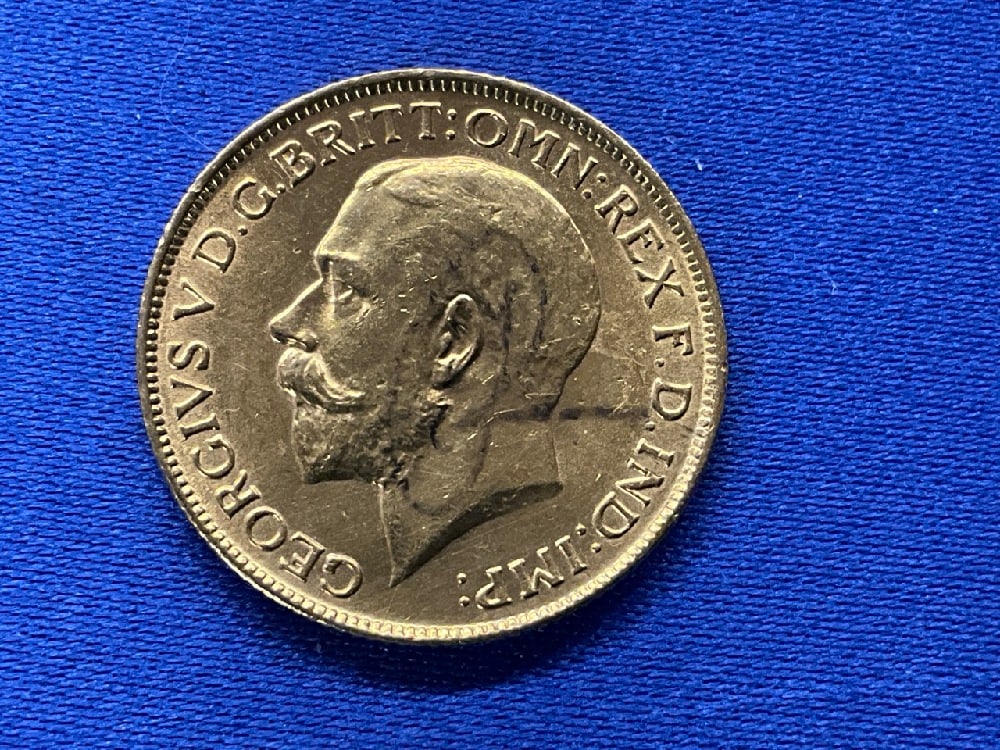 1918 British Sovereign Gold Coin: 1918 British Sovereign Gold Coin. Coin Purity .917. Coin Weight: 7.98 grams.