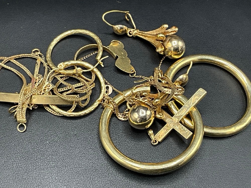 14K Yellow Gold Compiled Gold Jewelry for Repair: 14K Yellow Gold Compiled Gold Jewelry for Repair. Some single earrings, broken hoops, necklaces etc. As seen in photograph preview. Total weight: