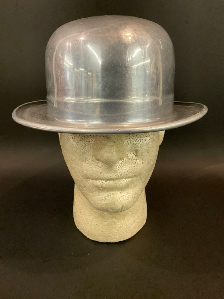 Metalite Company Aluminum Derby/Bowler Hat Mold: Metalite Company Aluminum Derby/Bowler Hat Mold.Condition: Light dings and dents. Dimensions: 11 1/4” x 10” brim to brim.4 1/4” tall. 8” x 6 1/2” interior.