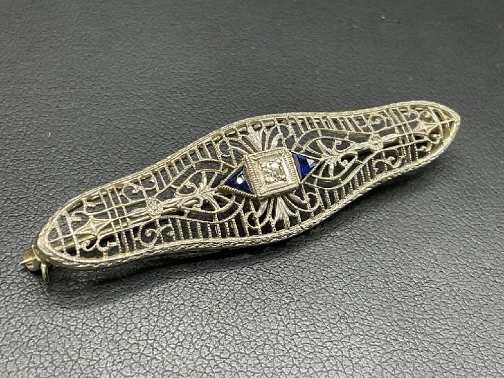 10K White Gold Sapphire and Diamond Pin: 10K White Gold Sapphire and Diamond Pin.Dimensions: 2” length. Total weight: 3.3 grams.