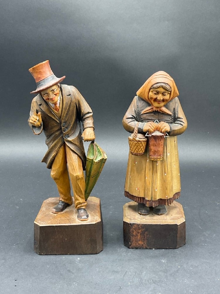 ANRIGerman Hand Carved Wooden Couple Figurines.: ANRI German Hand Carved Wooden Couple Figurines. Condition: Mail figure has finger damage. Please see photograph preview.Dimensions: 8”HProvenance: YMCA Frost Valley Castle Claryville, New York.