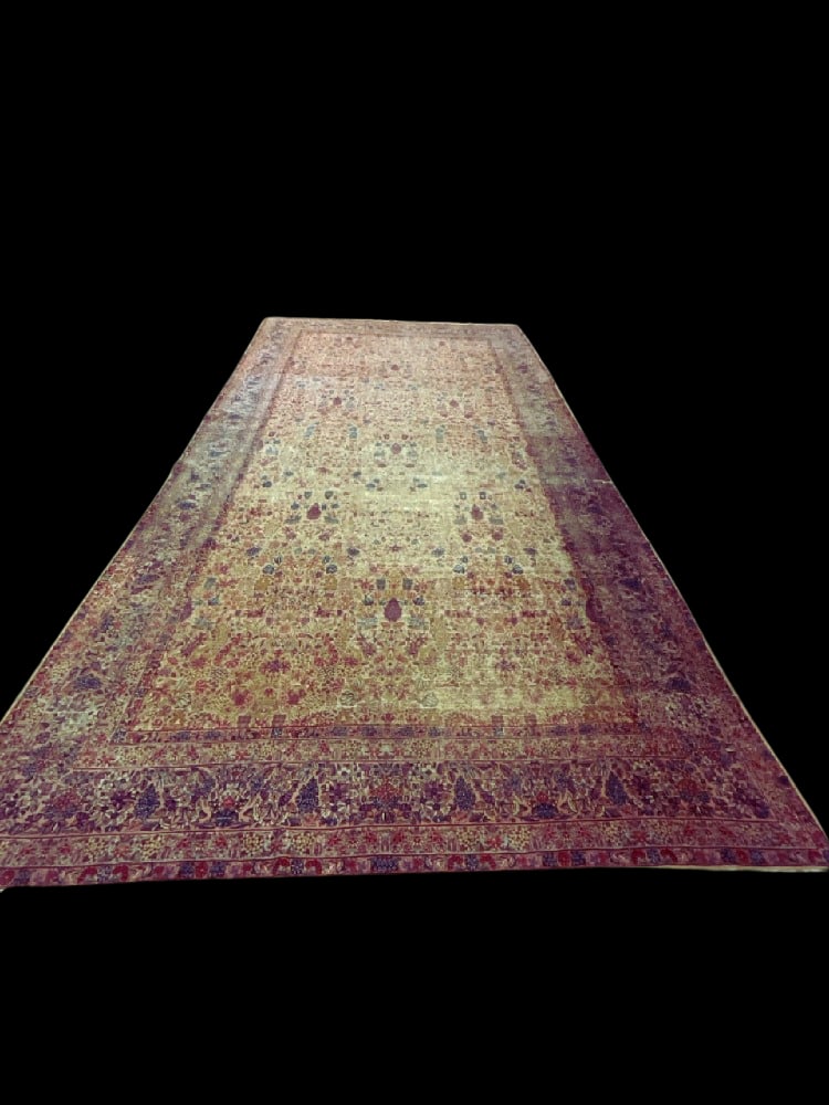 18ft X 10ft Kerman Persian Palace Size Wool Carpet: 18ft X 10ft Kerman Persian Palace Size Wool Carpet.1st half 20th century. Orignal stitched tag still present. Carpet has several areas of wear. No pet or musty odors. Provenance: YMCA Frost Valley