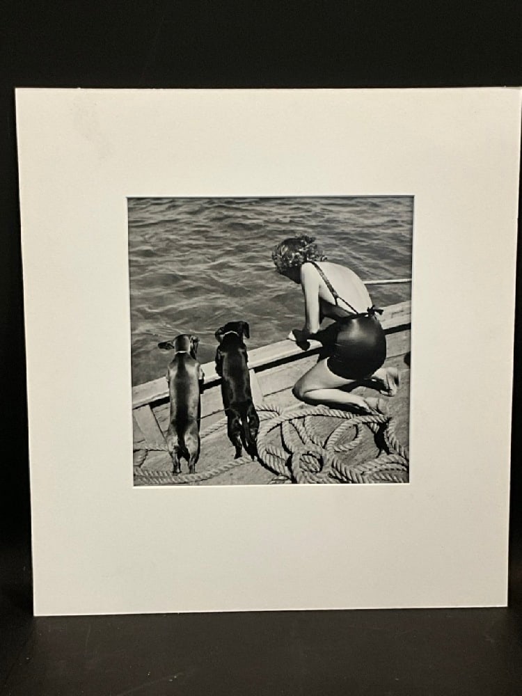 Toni Frissell (American, 1907-1988) 1940's Woman on Boat: Toni Frissell (American, 1907-1988) Untitled: Woman on Boat with two dogs looking over the edge. c. 1940's. Signed in pencil verso. Dimensions: 14” x 11”