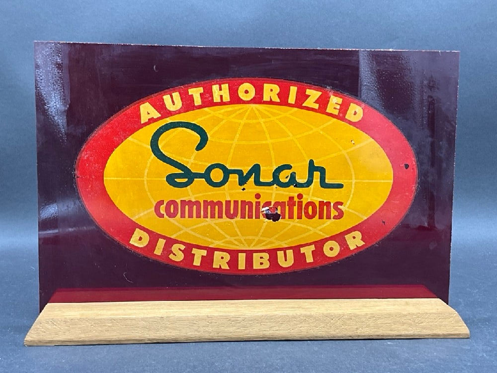 Authorized “ Sonar?? Communications Distributor Counter Sign: Authorized “ Sonar” Communications Distributor Counter Sign.Good Condition, Please See Preview Photographs ( noted pealed center)Dimensions: 14” L x 9”H ( sign) 14” L x 4&rdq