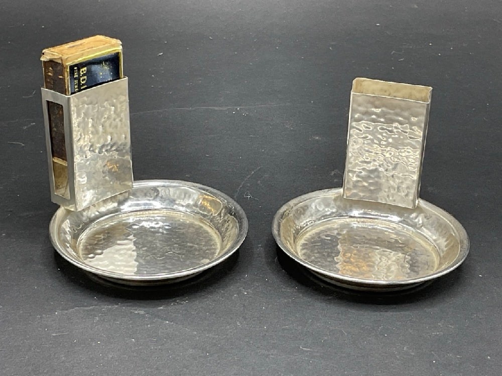 A Pair, Sterling Silver Art Deco Match Holder Ashtray Set: A Pair, Sterling Silver Art Deco Match Holder Ashtray Sets. Hand hammered design. Total weight: 73.4 gramsDimensions: 2 3/4” x 3”