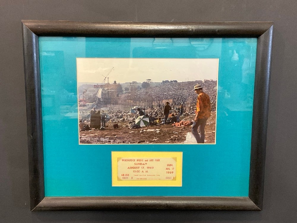 Original Sunday August 17th, 1969 Woodstock Admission Ticket with COA: Original Sunday August 17th, 1969 Woodstock Admission Ticket with COA and framed color photograph. Excellent condition. Please see photograph preview. Dimensions: 16 1/2” x 20”