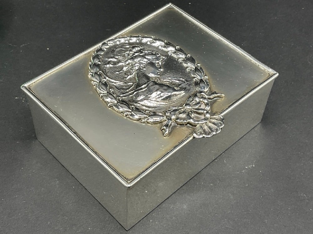 Sterling Silver Cameo Trinket Box: Sterling Silver Cameo Trinket Box. Marked Handmade, Sterling and Maker's Mark "M". Dimensions: 3 1/2” x 2 3/4” Total weight: 185 grams or 5.94 Troy ounces.