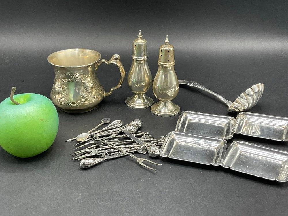 Compiled Estate Sterling Silver Tablewares: Compiled Estate Sterling Silver Table Wares. Including: Salt and pepper, four (4) rectangular dishes, hors d'oeuvre forks/picks, Joan of Arc ladle by International, Art Nouveau handled cup, etc. As