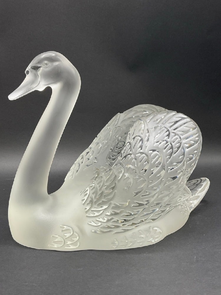 Large 13" Lalique Crystal Swan Statue: Large Lalique Crystal Swan Statue. Not signed. Condition: Flake chip seen on back of head and small flecks and scraches to base. Please see photograph preview. Dimensions: 9 1/2” x 13” x